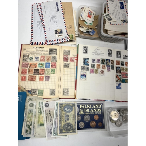 285 - Mixed collection of GB & international stamps, bank notes and coins, cigarette cases, and a Rytima w... 