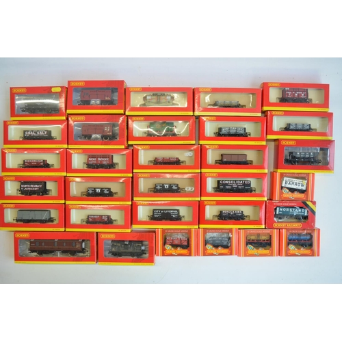 143 - Thirty one OO gauge goods wagon models from Hornby to include R6455 weathered BR green shark ballast... 