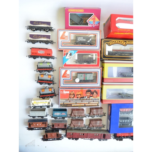 146 - Extensive collection of OO gauge rolling stock, boxed and unboxed, various manufacturers and conditi... 