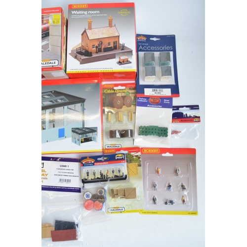 166 - Collection of OO gauge model railway scenic accessories, mostly station/railway maintenance related ... 