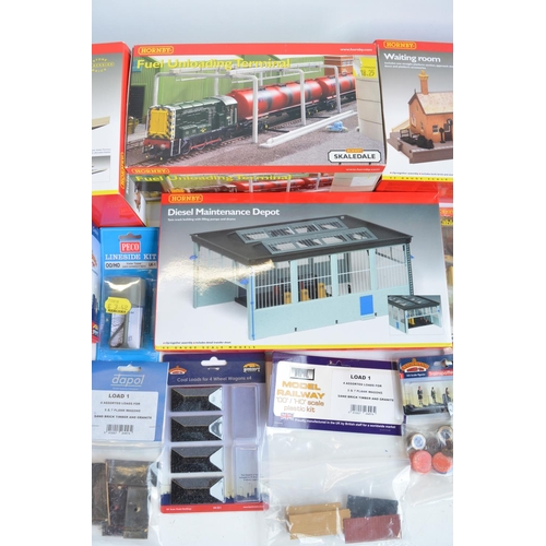 166 - Collection of OO gauge model railway scenic accessories, mostly station/railway maintenance related ... 