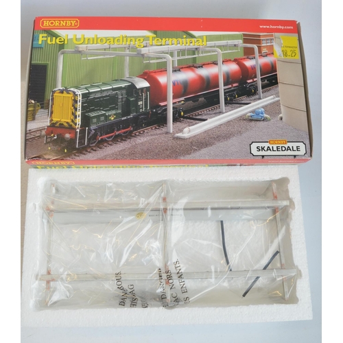 166 - Collection of OO gauge model railway scenic accessories, mostly station/railway maintenance related ... 