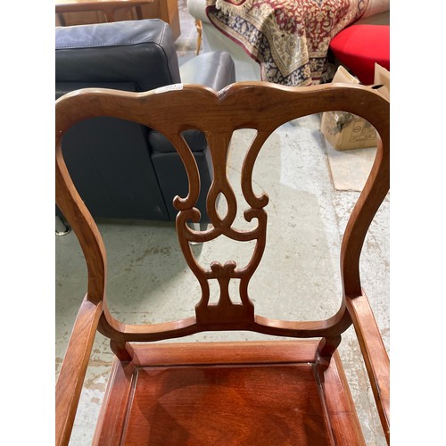 664 - C20th Chinese hardwood armchair with solid seat and carved detail