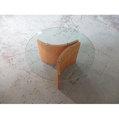 662 - Contemporary coffee table, circular smoked glass top on curved laminated supports, D75cm H42cm