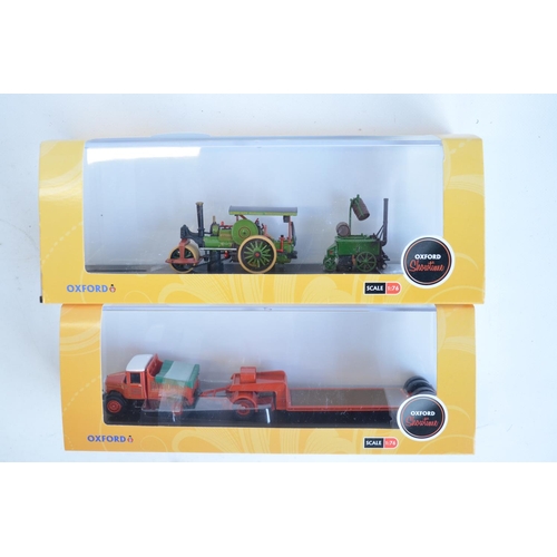 215 - Fourteen boxed 1/76 scale OO gauge diecast vehicle models from Oxford Diecast Showtime range to incl... 