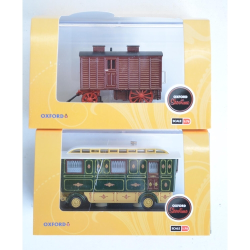 215 - Fourteen boxed 1/76 scale OO gauge diecast vehicle models from Oxford Diecast Showtime range to incl... 