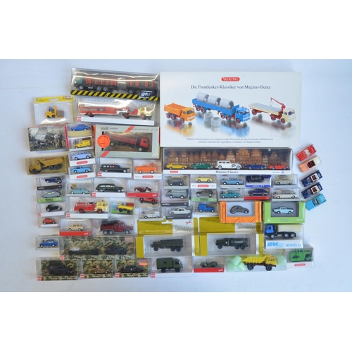 221 - Collection of 53 boxed mostly plastic 1/87 scale OO gauge vehicle models from Wiking, Herpa, Brekina... 