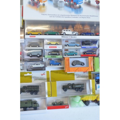 221 - Collection of 53 boxed mostly plastic 1/87 scale OO gauge vehicle models from Wiking, Herpa, Brekina... 