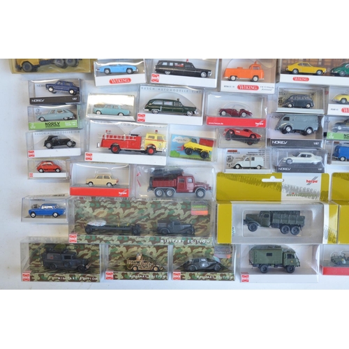 221 - Collection of 53 boxed mostly plastic 1/87 scale OO gauge vehicle models from Wiking, Herpa, Brekina... 