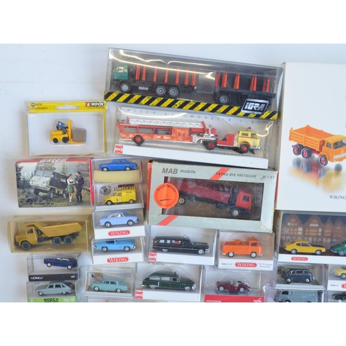 221 - Collection of 53 boxed mostly plastic 1/87 scale OO gauge vehicle models from Wiking, Herpa, Brekina... 