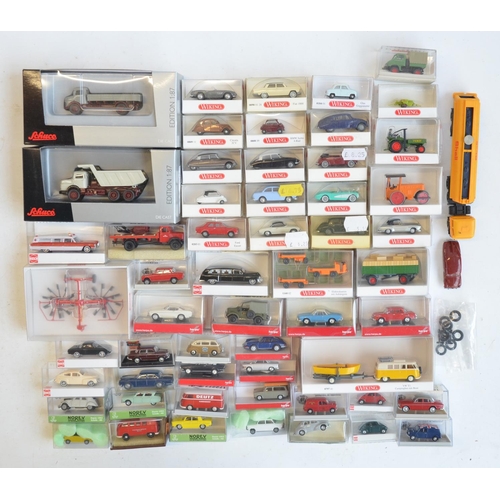 222 - Collection of 56 boxed mostly plastic 1/87 scale OO gauge vehicle models from Wiking, Herpa, Brekina... 