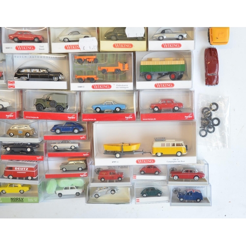 222 - Collection of 56 boxed mostly plastic 1/87 scale OO gauge vehicle models from Wiking, Herpa, Brekina... 