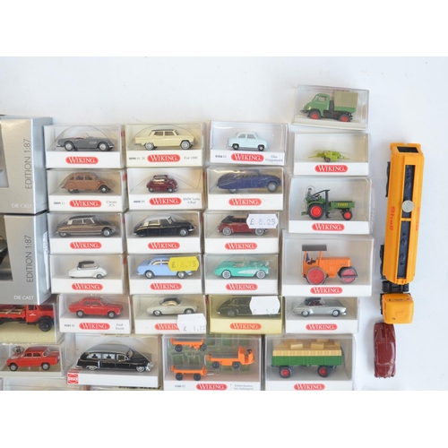 222 - Collection of 56 boxed mostly plastic 1/87 scale OO gauge vehicle models from Wiking, Herpa, Brekina... 