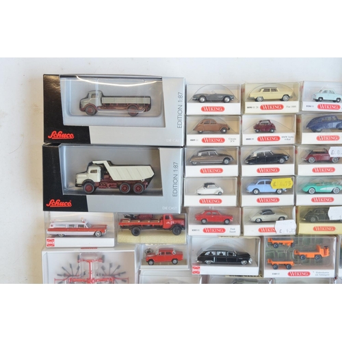 222 - Collection of 56 boxed mostly plastic 1/87 scale OO gauge vehicle models from Wiking, Herpa, Brekina... 