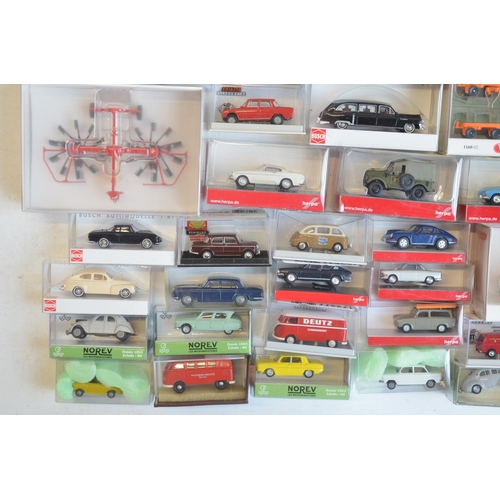 222 - Collection of 56 boxed mostly plastic 1/87 scale OO gauge vehicle models from Wiking, Herpa, Brekina... 