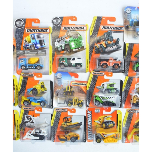 249 - Twenty six boxed Matchbox vehicles, mostly from the MBX Construction to include 5 vehicle Service Sq... 