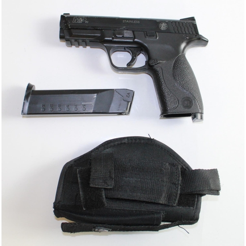 543 - K.W.L Air soft 'Smith & Wesson' assault pistol  with Magazine and webbing holster. Restrictions appl... 