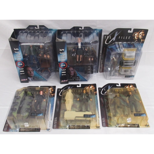 351 - The X-Files - 4 McFarlane toys cased X-Files action figures, yellowing to cases and some wear, cases... 