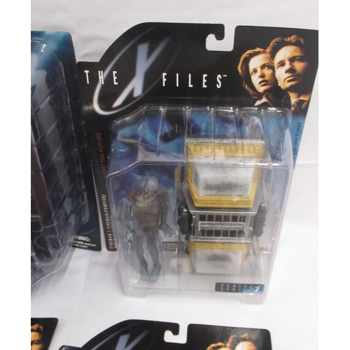 351 - The X-Files - 4 McFarlane toys cased X-Files action figures, yellowing to cases and some wear, cases... 