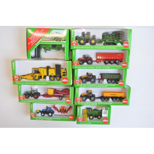 259 - Nine boxed 1/87 scale (HO gauge) diecast farming models from Siku to include 1876 John Deere combine... 