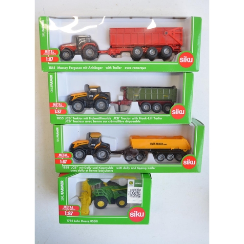 259 - Nine boxed 1/87 scale (HO gauge) diecast farming models from Siku to include 1876 John Deere combine... 