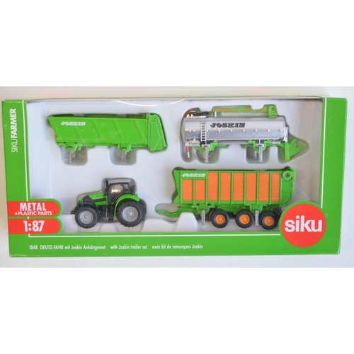 260 - Nine boxed 1/87 scale (HO gauge) diecast farming models from Siku to include 1882 Krone self propell... 