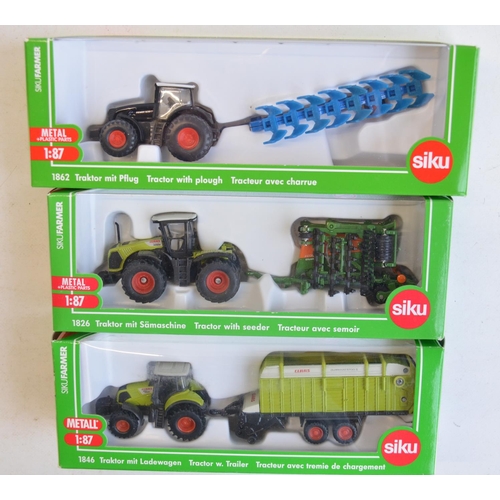 260 - Nine boxed 1/87 scale (HO gauge) diecast farming models from Siku to include 1882 Krone self propell... 