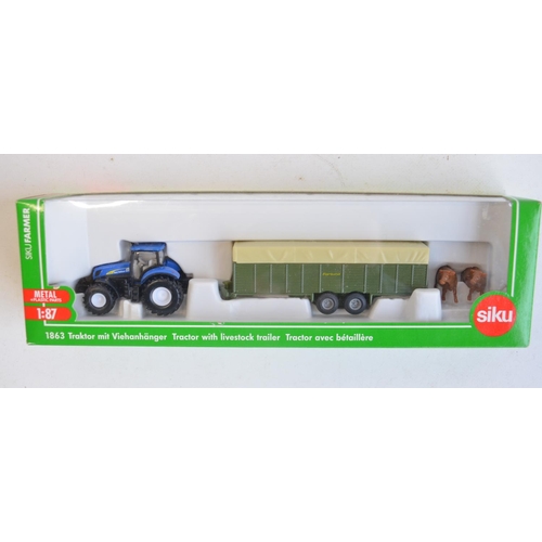 260 - Nine boxed 1/87 scale (HO gauge) diecast farming models from Siku to include 1882 Krone self propell... 