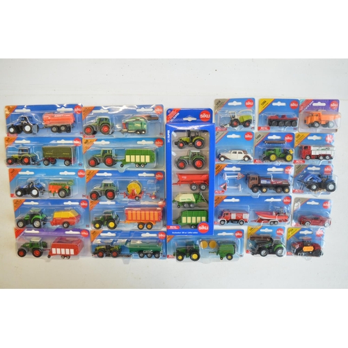 261 - Twenty four boxed diecast vehicle models from Siku to include farming, commercial, emergency etc. Al... 