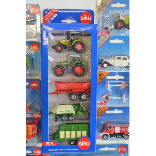 261 - Twenty four boxed diecast vehicle models from Siku to include farming, commercial, emergency etc. Al... 