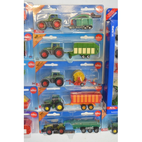 261 - Twenty four boxed diecast vehicle models from Siku to include farming, commercial, emergency etc. Al... 