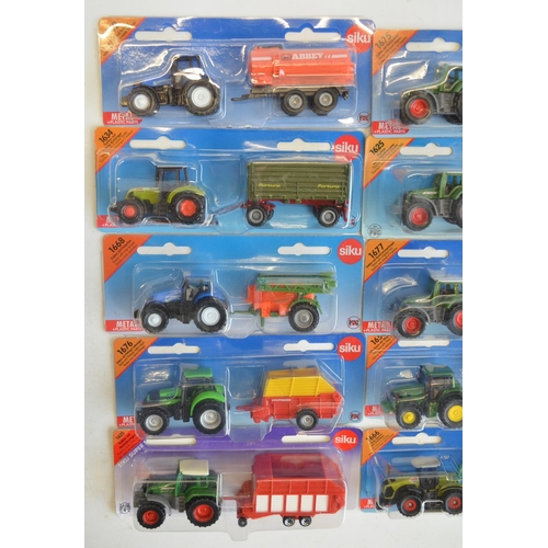 261 - Twenty four boxed diecast vehicle models from Siku to include farming, commercial, emergency etc. Al... 