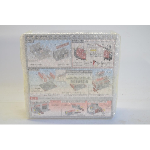 264 - Tomica Town 1/64 scale Nissan racing team Nismo pit as new in original outer shipping bubble wrap, n... 