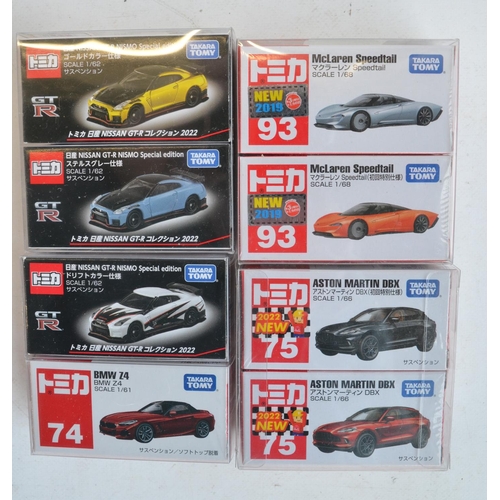 286 - Sixteen boxed Japanese imported small scale diecast sports and racing car models from Takara Tomy to... 