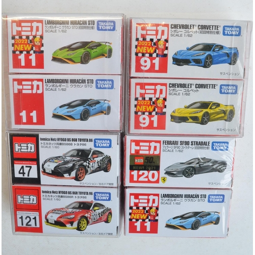 286 - Sixteen boxed Japanese imported small scale diecast sports and racing car models from Takara Tomy to... 