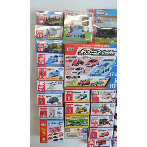 293 - Fifty boxed Japanese imported small scale Takara Tomy diecast models to include TV/film related mode... 