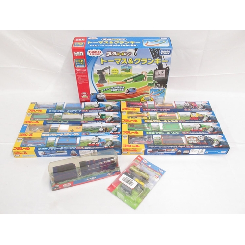 325 - Thomas the Tank Engine - Takara TOMY boxed and cased trains and carriages (9), a boxed track set and... 