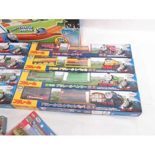 325 - Thomas the Tank Engine - Takara TOMY boxed and cased trains and carriages (9), a boxed track set and... 