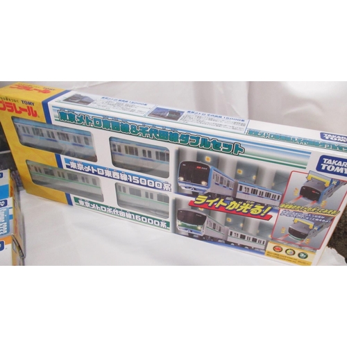 327 - Large collection of Takara TOMY Japanese Import boxed trains and carriages, (89 in 3 boxes)