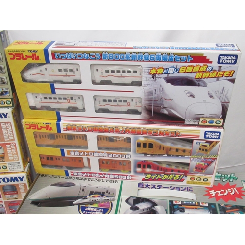 327 - Large collection of Takara TOMY Japanese Import boxed trains and carriages, (89 in 3 boxes)