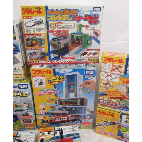 328 - 16 boxed Takara TOMY Japanese import boxed train stations and buildings, some opened some sealed, al... 