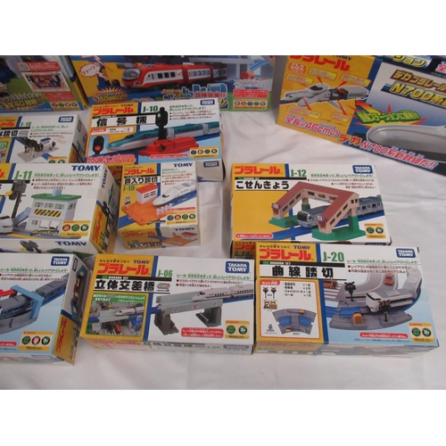 328 - 16 boxed Takara TOMY Japanese import boxed train stations and buildings, some opened some sealed, al... 