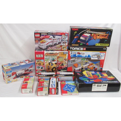 329 - Assorted collection of boxed/cased TOMY toys to include Japanese Import, TOMICA, etc., some sealed o... 