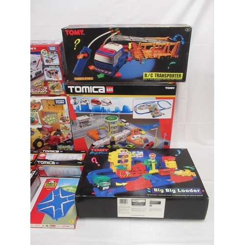 329 - Assorted collection of boxed/cased TOMY toys to include Japanese Import, TOMICA, etc., some sealed o... 