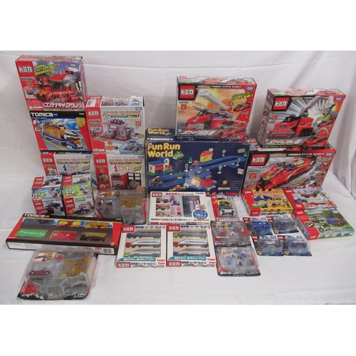 329 - Assorted collection of boxed/cased TOMY toys to include Japanese Import, TOMICA, etc., some sealed o... 