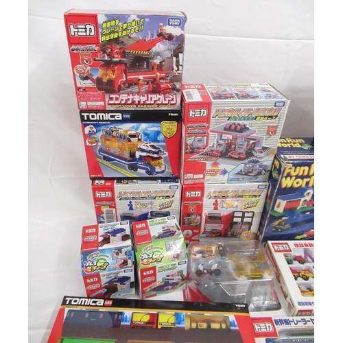 329 - Assorted collection of boxed/cased TOMY toys to include Japanese Import, TOMICA, etc., some sealed o... 