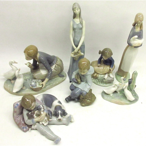 271 - Collection of Lladro and Nao figures, incl. a girl feeding ducks, boy with puppies, etc. (7)