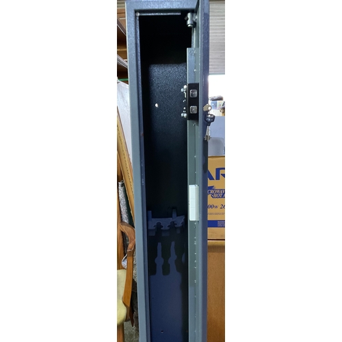 650 - A metal gun cabinet designed for 3 guns double lock with 2 sets of keys 
Measurements 150cm x 22cm x... 