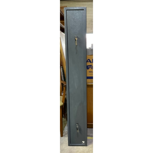 650 - A metal gun cabinet designed for 3 guns double lock with 2 sets of keys 
Measurements 150cm x 22cm x... 