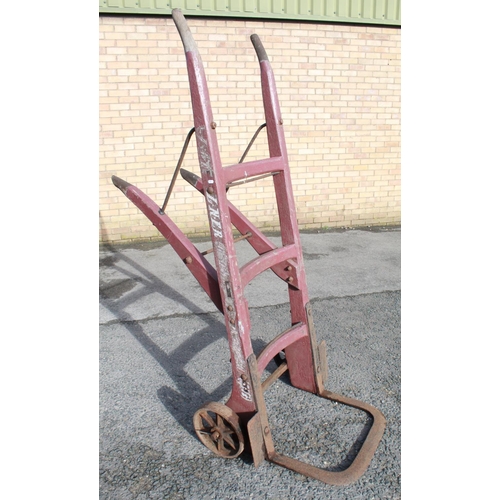 1203 - C20th L.N.E.R. heavy duty large luggage porters trolley with cast wheels, painted in red, stamped nu... 